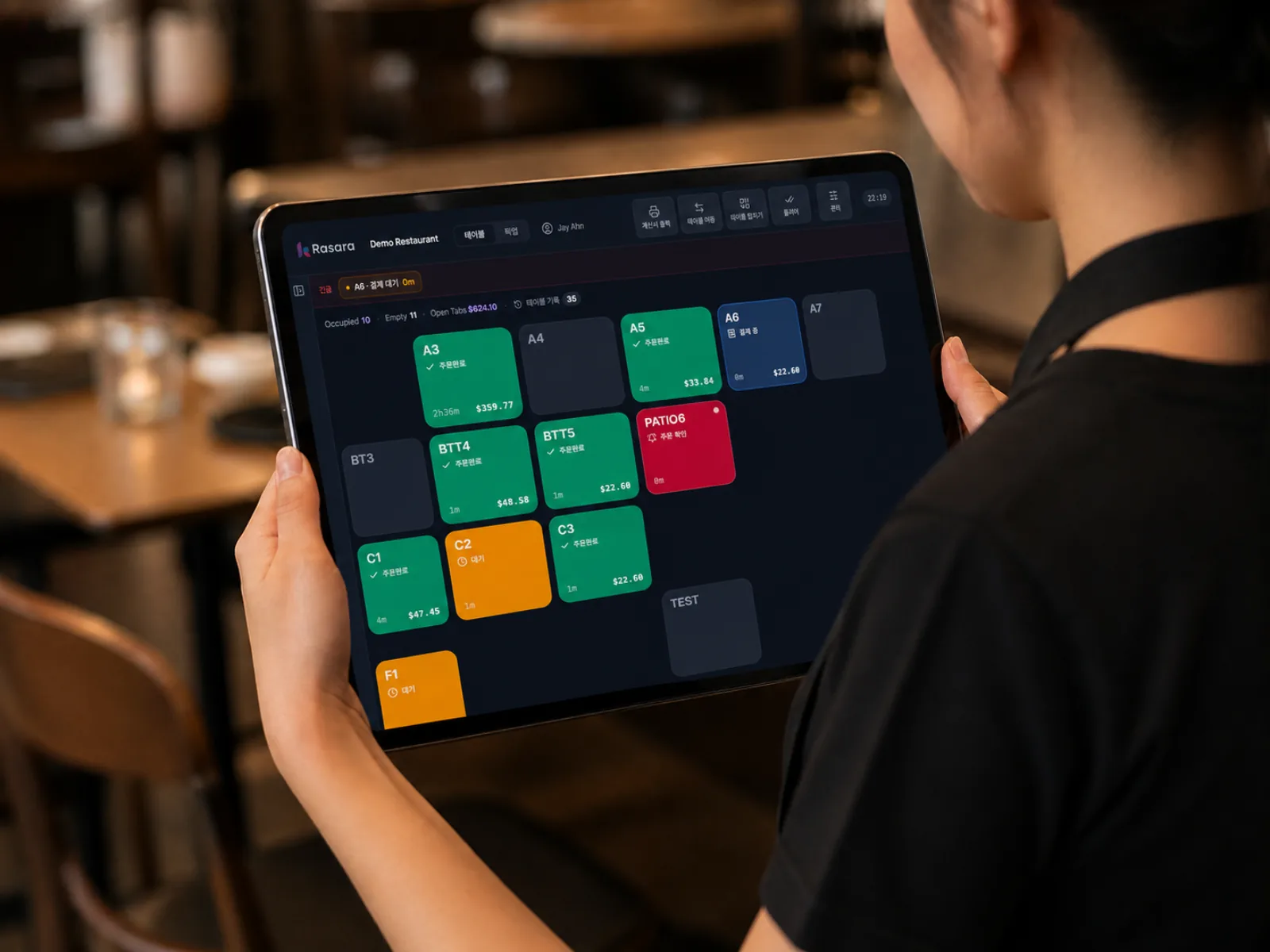 A server checking table status on the dashboard
